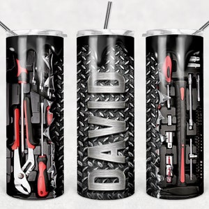 May include: Three stainless steel tumblers with a black and silver design. The tumblers feature a tool pattern, a name "DAVID", and a tool pattern. Each tumbler has a straw.