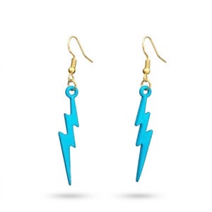 May include: A pair of dangle earrings featuring bright turquoise lightning bolt charms suspended from gold-toned metal fishhook wires. The lightning bolt pendants have a smooth, matte finish and a sharp, angular shape, hanging vertically from the hooks.