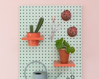 Large metal pegboard in mint, wall display peg board