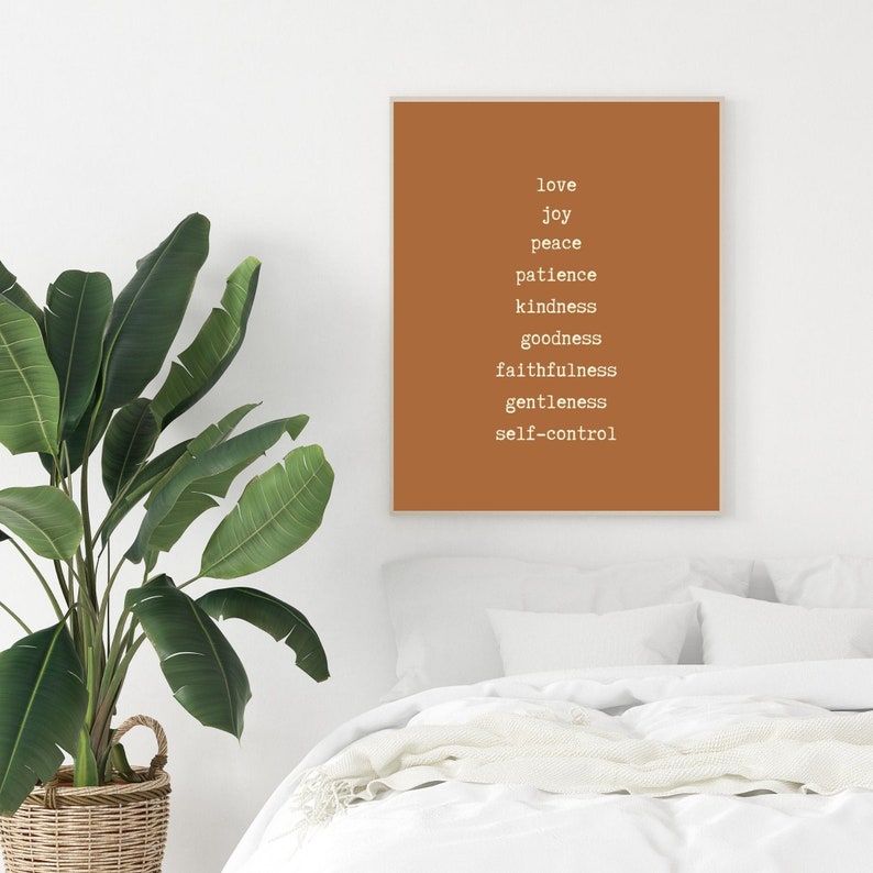 May include: A brown poster with white text listing the fruits of the spirit: love, joy, peace, patience, kindness, goodness, faithfulness, gentleness, and self-control.