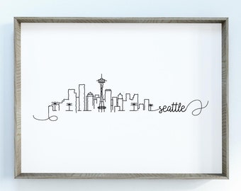 May include: A black and white line drawing of the Seattle skyline, including the Space Needle, with the word "seattle" written in cursive.