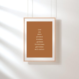 May include: A framed print with a brown background and white text. The text reads "love, joy, peace, patience, kindness, goodness, faithfulness, gentleness, self-control".