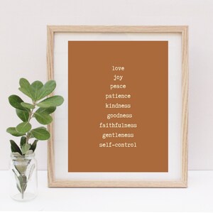 May include: A framed print with a brown background and white text. The text reads "love, joy, peace, patience, kindness, goodness, faithfulness, gentleness, self-control".