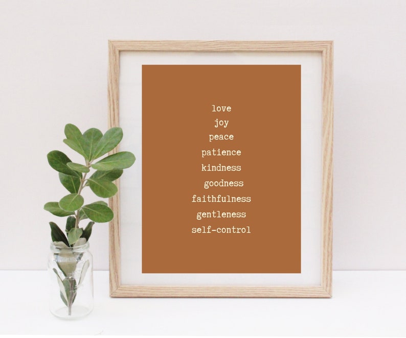 May include: A framed print with a brown background and white text. The text reads "love, joy, peace, patience, kindness, goodness, faithfulness, gentleness, self-control".