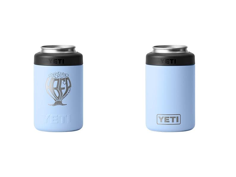 May include: Two light blue YETI can coolers. One has a silver graphic with the letters "BFD" and a tree design. The other has the YETI logo. Both have a black top and silver rim.