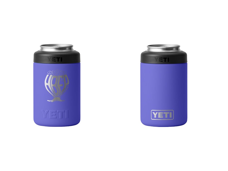 May include: Two purple YETI can coolers. One has a silver graphic of a hot air balloon with the word "YETI" below it. The other has the word "YETI" in a silver rectangle. Both have a black top and silver rim.