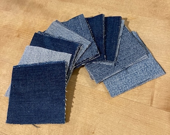 May include: A collection of denim fabric squares in various shades of blue, arranged in a semi-circle pattern. The squares are all the same size and have a raw edge.