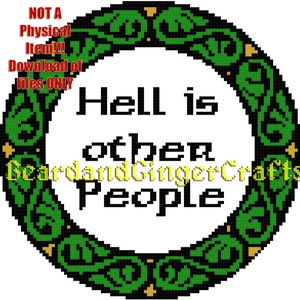 May include: A green and gold circular design with a white background and the text "Hell is other people".
