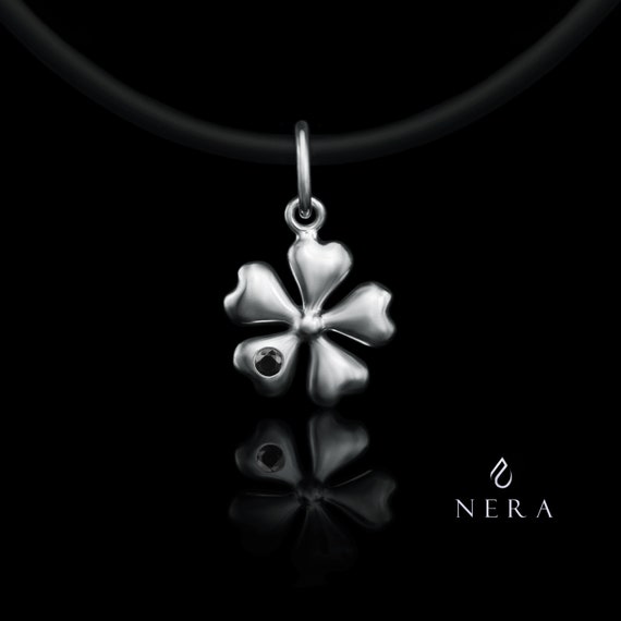 Minimalist black four leaf clover necklace pendant, white background on  Craiyon