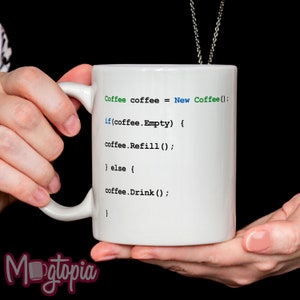 May include: White ceramic coffee mug with a humorous programming code printed on it. The code reads: "Coffee coffee = New Coffee(); if(coffee.Empty) { coffee.Refill(); } else { coffee.Drink(); }"