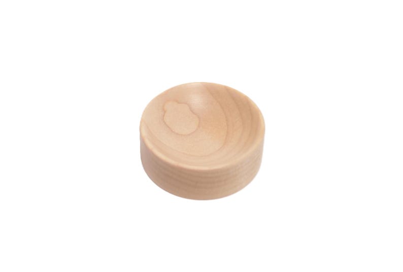 May include: A small, round, wooden bowl with a smooth, light brown finish.
