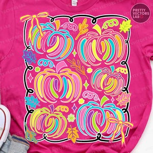 May include: A hot pink t-shirt featuring a colorful pumpkin design. The pumpkins are outlined in black and filled with bright pink, yellow, green, and purple. The design includes leaves, bows, and the text "PRETTY VECTORS LAB".