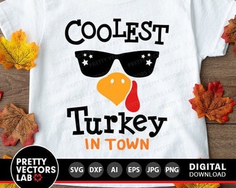 May include: White t-shirt with a black and orange turkey graphic. The turkey is wearing sunglasses and the text "Coolest Turkey in Town" is printed below the image.