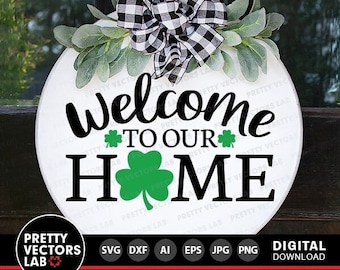 May include: A white round wooden sign with a black and white checked bow and green shamrock leaves. The sign says "Welcome to our Home" in black lettering.