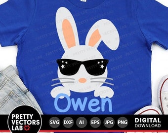 May include: A blue t-shirt with a white bunny wearing sunglasses and the name "Owen" printed on the front.