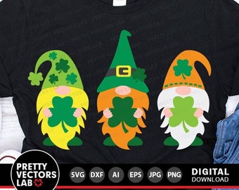 May include: Three gnomes wearing green hats with shamrocks on them. The gnomes are holding green shamrocks in their hands. The gnomes are wearing yellow, orange, and white clothing. The gnomes are on a black background.