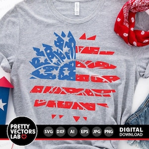 May include: A gray t-shirt with a red, white, and blue American flag design. The flag is made up of small stars and stripes. The design is in the shape of a flower.