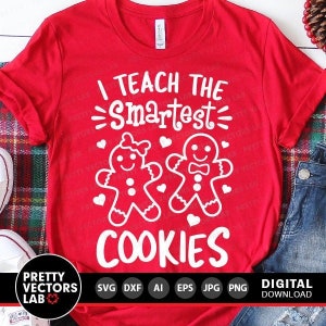May include: Red t-shirt with white text that reads "I teach the smartest cookies". The text is surrounded by two gingerbread cookies, one with a bow and the other with a bow tie.
