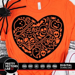 May include: Orange t-shirt with a black heart-shaped design filled with Halloween-themed icons like bats, ghosts, skulls, and the word "BOO".
