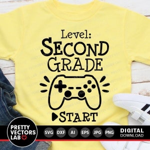May include: A yellow t-shirt with a black video game controller graphic and the text "Level: Second Grade" and "Start".