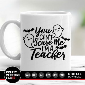 May include: White ceramic mug with a black design that says "You can't scare me I'm a teacher" with ghost and bat illustrations.