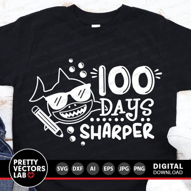 May include: A black t-shirt with a white shark wearing sunglasses and a pencil. The text "100 Days Sharper" is written in white on the shirt.