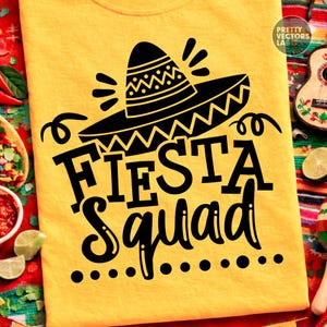 May include: Yellow t-shirt with a black sombrero graphic and the words "Fiesta Squad". The design includes decorative elements and dots. The shirt is likely for a Cinco de Mayo or Mexican-themed event.