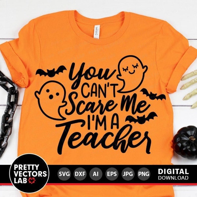 May include: Orange t-shirt with a black graphic that says "You Can't Scare Me I'm A Teacher" with a ghost and bats.