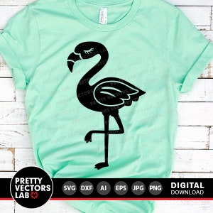 May include: A black silhouette of a flamingo with one leg raised, standing on a light green t-shirt. The t-shirt is a blank canvas for a design.