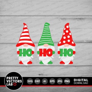 May include: Three gnomes with red, white, and green hats holding signs that say "Ho Ho" in green letters. The gnomes are standing on a gray wooden background.
