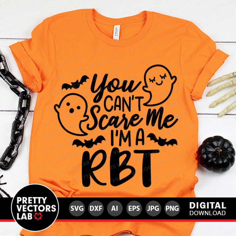May include: Orange t-shirt with a black graphic that says "You Can't Scare Me I'm a RBT" with a ghost and bats.