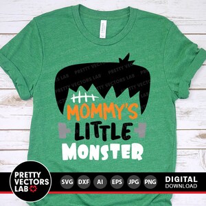 May include: Green t-shirt with a black and white Frankenstein monster graphic. The text "Mommy's Little Monster" is printed in orange and white.