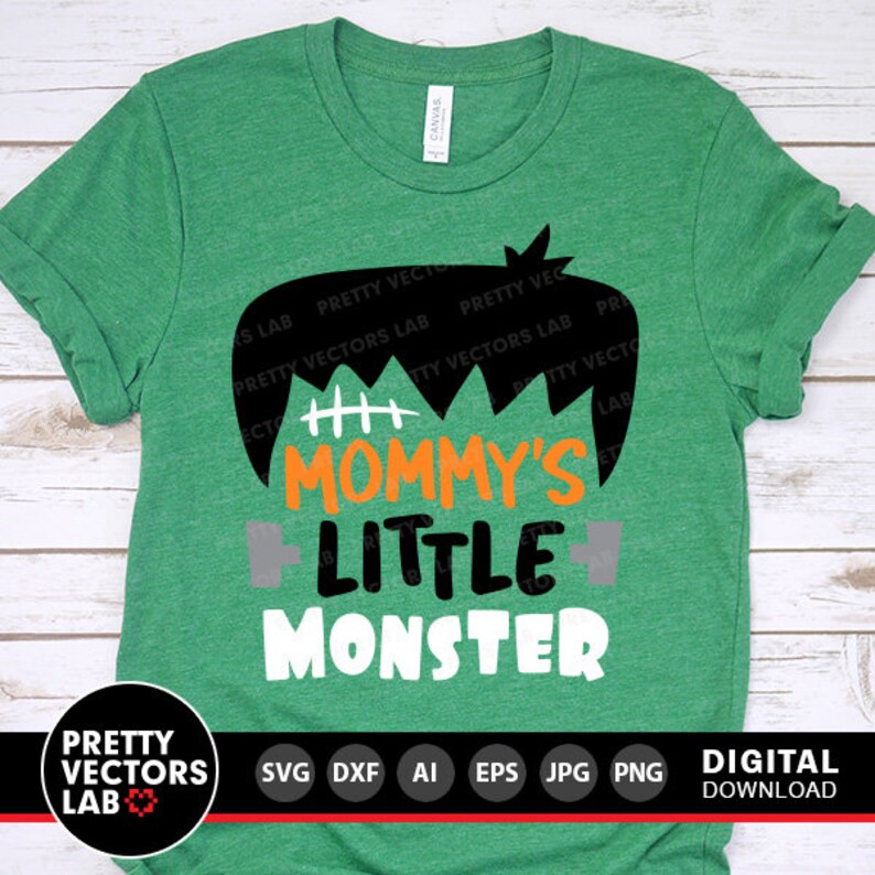 May include: Green t-shirt with a black and white Frankenstein monster graphic. The text "Mommy's Little Monster" is printed in orange and white.
