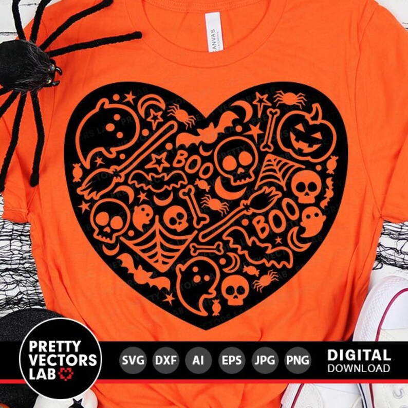 May include: Orange t-shirt with a black heart-shaped design filled with Halloween-themed icons like bats, ghosts, skulls, and the word "BOO".