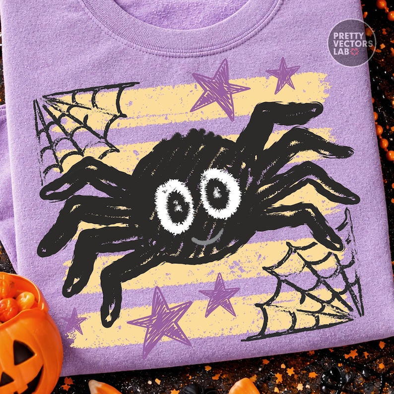 May include: A light purple t-shirt featuring a graphic of a black spider with large white eyes and a small smile. The design includes yellow horizontal stripes, purple stars, and black spiderwebs in the corners. The text Pretty Vectors Lab is visible.
