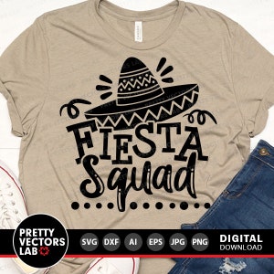 May include: A tan t-shirt with the words "FIESTA Squad" in bold black letters, topped with a black sombrero. The shirt is paired with blue jeans and white sneakers. The design includes a digital download option.