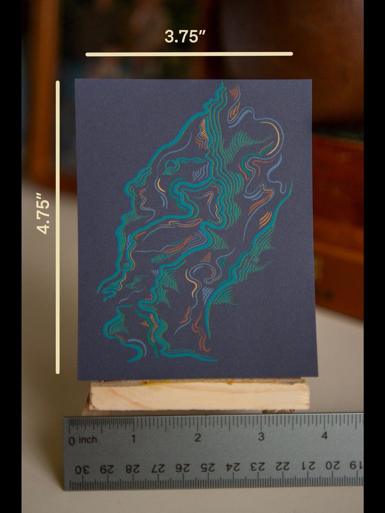 May include: A colorful abstract print on dark blue paper, measuring 3.75 inches by 4.75 inches. The print features swirling lines in shades of teal, orange, and yellow.