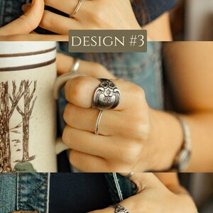 May include: Three different designs of spoon rings. The rings are made from vintage silverware and feature a floral design. The rings are shown on a person's hand.