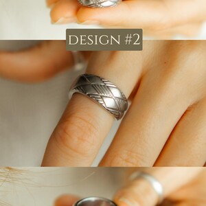 May include: A silver ring with a geometric pattern. The ring is shown on a finger and is open on one side.