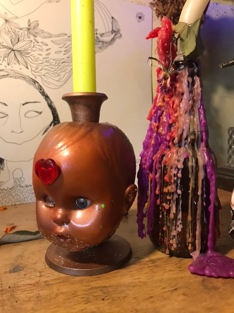 Baby doll head candle holder