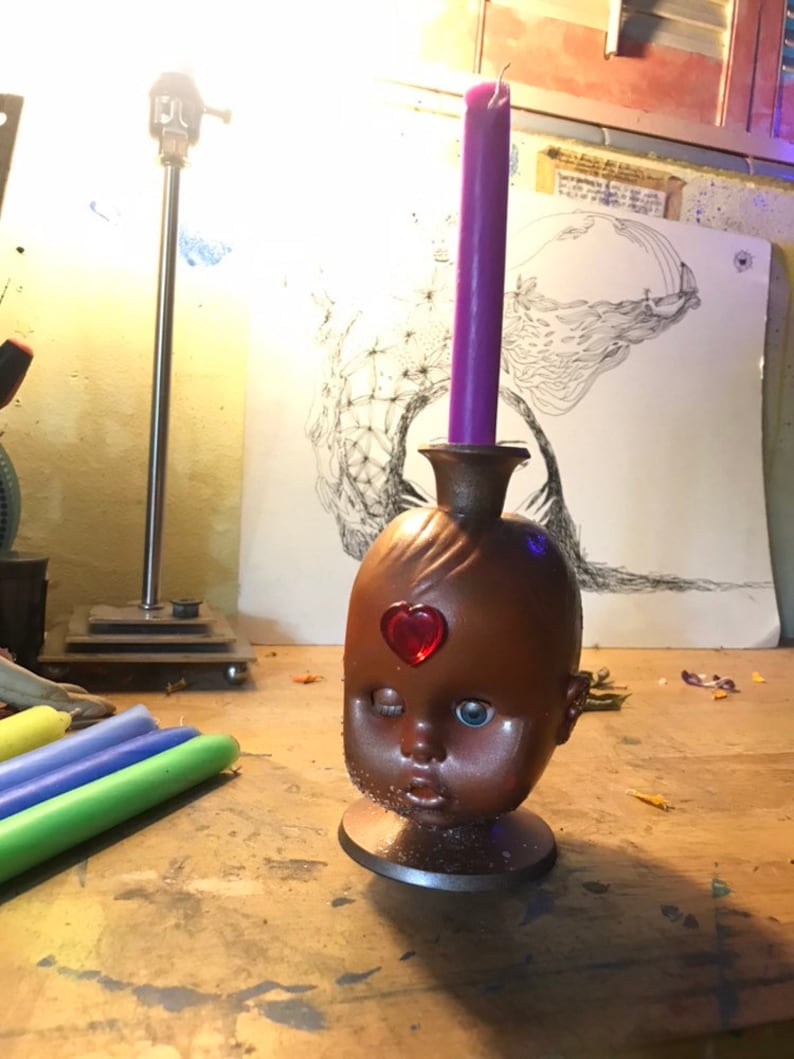 Baby doll head candle holder