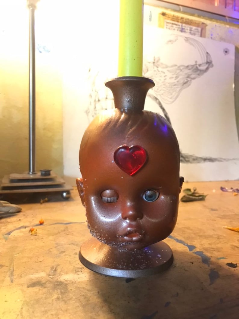 Baby doll head candle holder