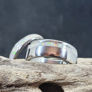 Titanium wedding rings with white opal inlays. opal inlay wedding ring