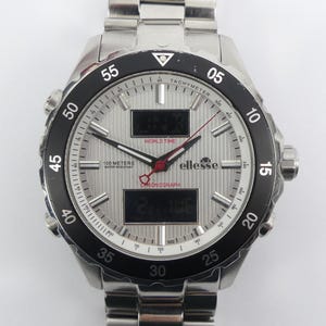 May include: A silver wristwatch with a black bezel and a textured silver face. The watch features digital displays, a tachymeter, and the brand name "ellesse". Water-resistant to 100 metres.