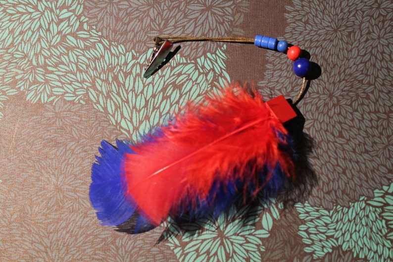 Hair clip fascinator red blue feather glitter cute magic Indian wizard enchants playful charm gift