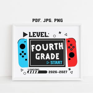 May include: A framed digital print featuring a video game controller theme with the text "LEVEL: FOURTH GRADE" and "START" in the center. The design includes a loading bar, the text "LOADING..." and "2026-2027", with blue and red controller sides.