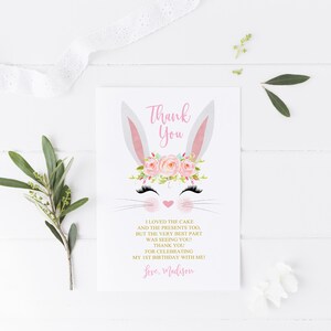 May include: Thank you card with a bunny rabbit illustration wearing a pink flower crown. The text reads "Thank You I loved the cake and the presents too, but the very best part was seeing you! Thank you for celebrating my 1st birthday with me. Love, Madison."