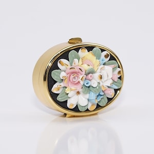 Vintage French Pill Box with Porcelain Flowers, Jewelry Box, Trinket Box, hinged lid, gilded, oval, gold, black, pastel shades, floral, rose