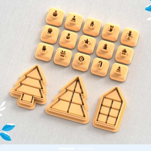 May include: A set of 18 cookie cutters featuring various Christmas-themed designs, including trees, ornaments, stars, and candy canes. The cutters are made of a light brown plastic and are arranged in a grid pattern on a light gray surface. There are also three larger cookie cutters in the shape of Christmas trees and a house.