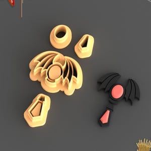 May include: A set of five cookie cutters in the shape of a bat, a bat wing, a bat's eye, a bat's ear, and a bat's tie. The cutters are made of a light brown plastic and are designed for making Halloween cookies.